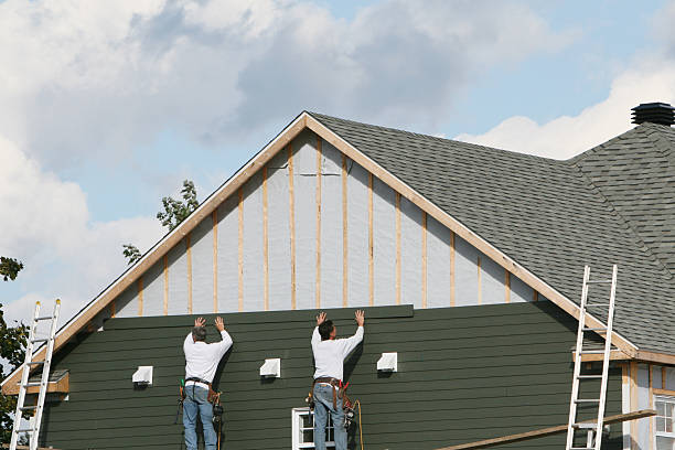 Professional Siding technician working in Wingate, MD